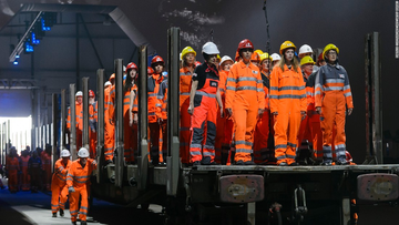 A performance inside the Gotthard Base Tunnel in Switzerland demonstrates the obedient ‘labor’ class of Humanity